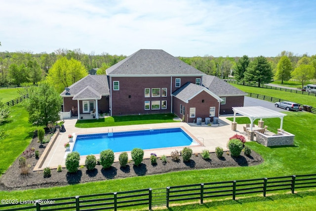 view of pool with a lawn, fence, a fenced in pool, and a patio area