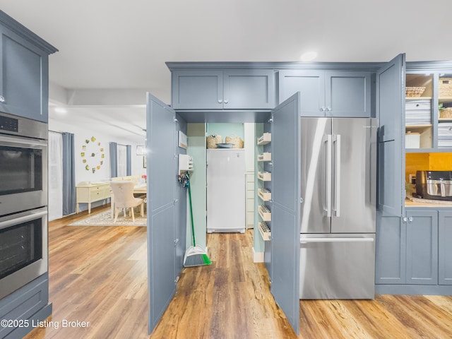 kitchen featuring appliances with stainless steel finishes and light wood-style floors