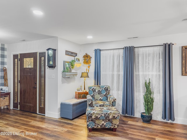sitting room featuring recessed lighting, baseboards, and wood finished floors