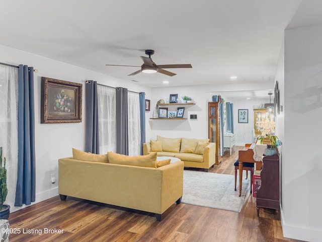 living area with a ceiling fan, baseboards, recessed lighting, and wood finished floors