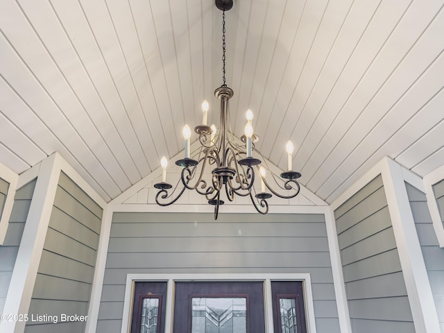 interior details with wood walls and a notable chandelier