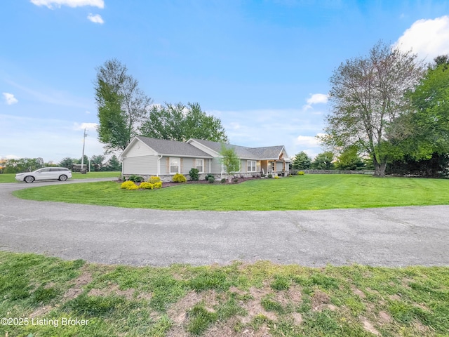 exterior space with fence and a yard