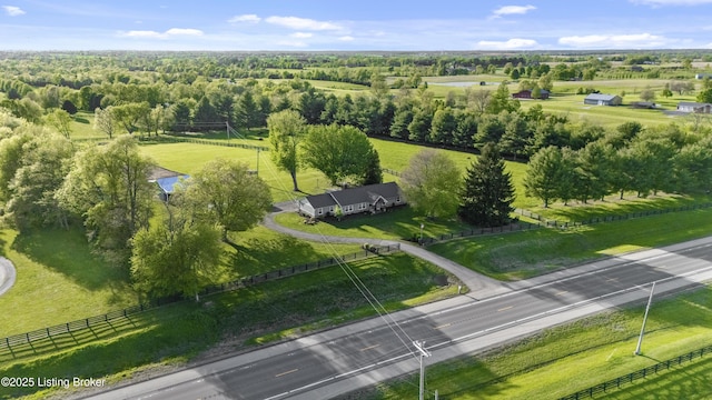 birds eye view of property with a rural view