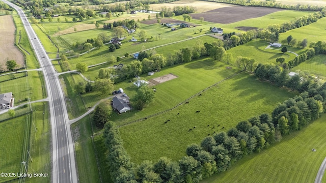 birds eye view of property with a rural view