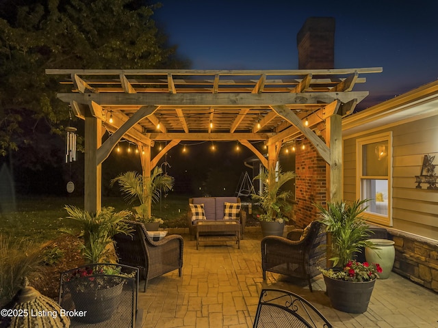 patio at twilight with an outdoor living space and a pergola