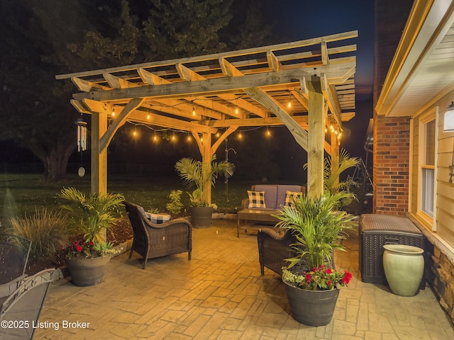 patio at twilight featuring a pergola and an outdoor living space