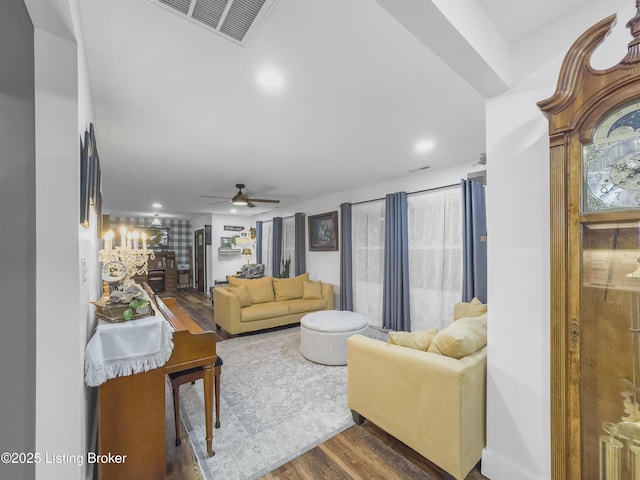 living area with ceiling fan, recessed lighting, wood finished floors, and visible vents