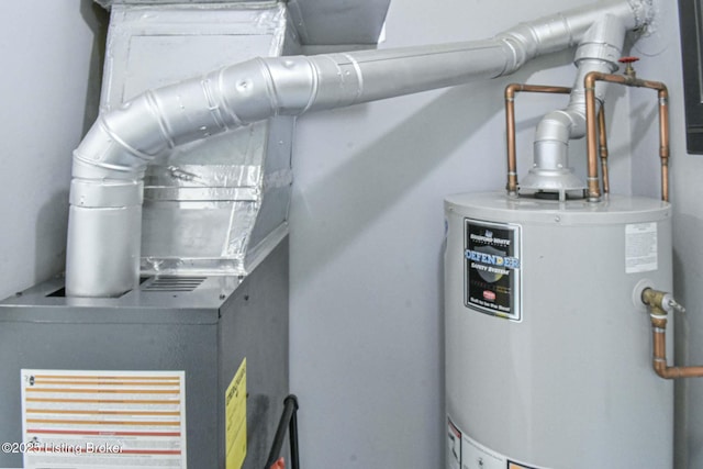utility room with gas water heater