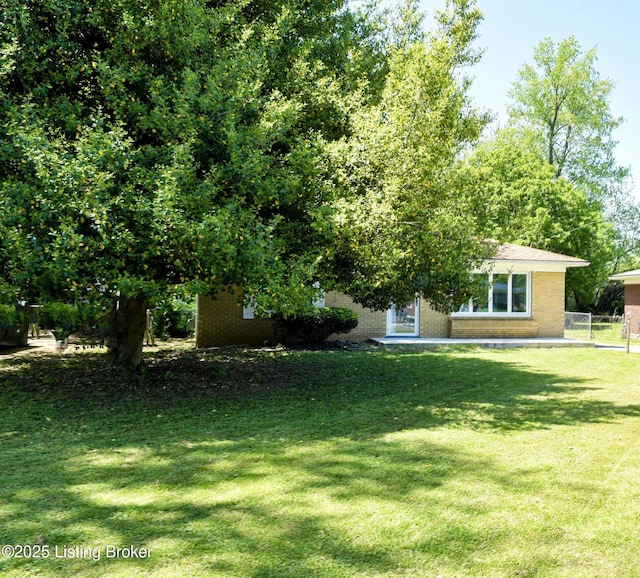 view of yard with fence