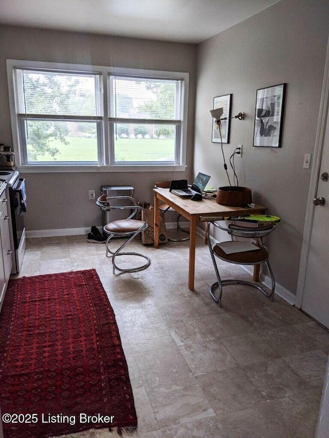 office with baseboards and a wealth of natural light