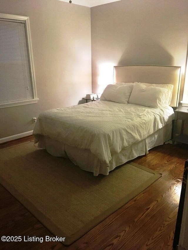 bedroom with wood finished floors