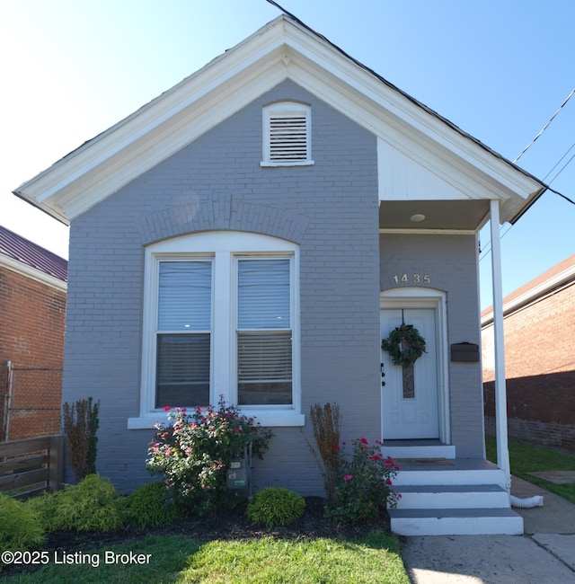 view of front of house featuring brick siding