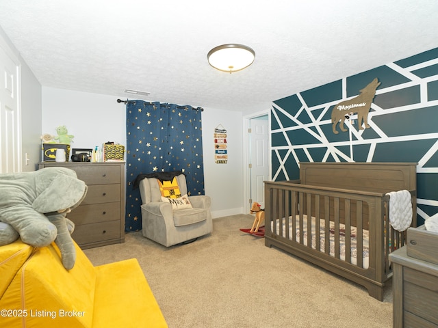 bedroom with carpet and a textured ceiling