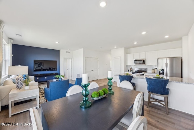 11036 Pheasant Hill Cir, Louisville, KY 40229 - dining room with recessed lighting, light wood-style flooring, and visible vents