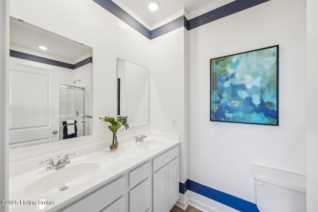 11036 Pheasant Hill Cir, Louisville, KY 40229 - full bathroom featuring double vanity, toilet, a sink, and a shower with shower door