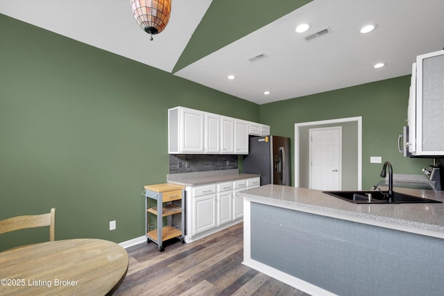 10002 Brownsboro Gardens Cir, Louisville, KY 40241 - kitchen featuring visible vents, wood finished floors, white cabinetry, stainless steel fridge with ice dispenser, and a sink