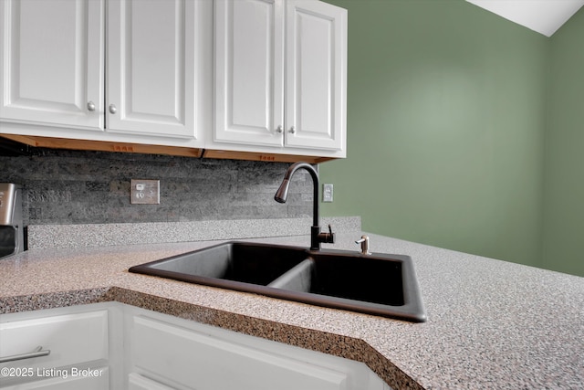 10002 Brownsboro Gardens Cir, Louisville, KY 40241 - interior space featuring a sink, white cabinetry, decorative backsplash, and light countertops