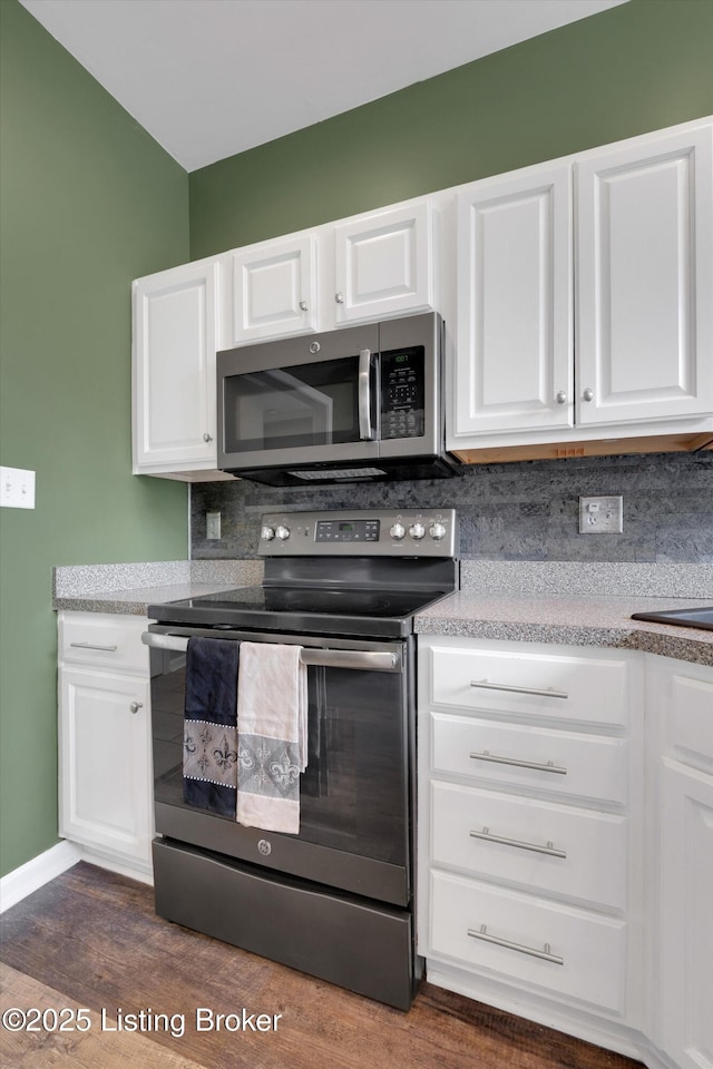 10002 Brownsboro Gardens Cir, Louisville, KY 40241 - kitchen featuring decorative backsplash, dark wood-style flooring, light countertops, white cabinets, and stainless steel appliances