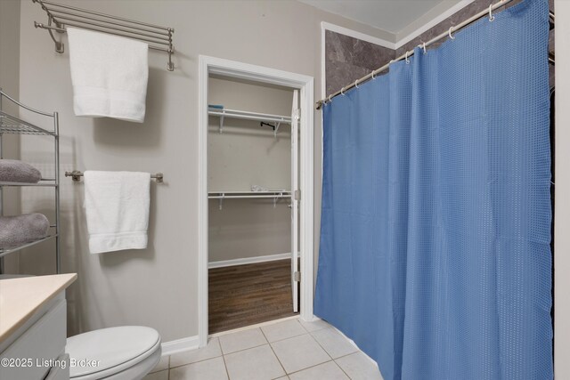 10002 Brownsboro Gardens Cir, Louisville, KY 40241 - bathroom with tile patterned flooring, curtained shower, vanity, baseboards, and toilet