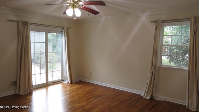 unfurnished room with crown molding, a ceiling fan, visible vents, and plenty of natural light