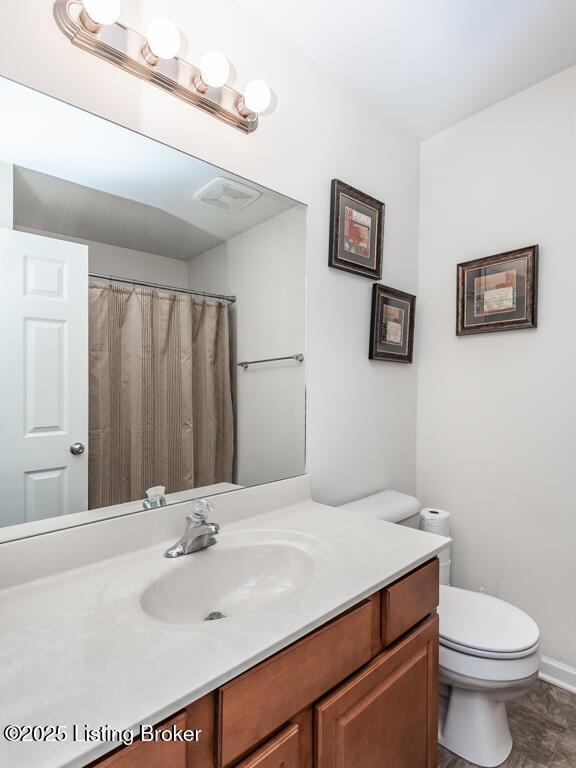 220 Rockcrest Way, Louisville, KY 40245 - full bathroom with vanity, toilet, and baseboards