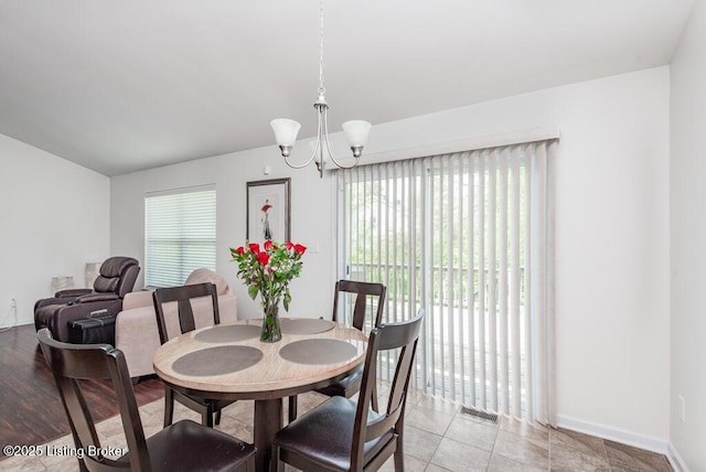 220 Rockcrest Way, Louisville, KY 40245 - dining room with a chandelier, baseboards, and vaulted ceiling