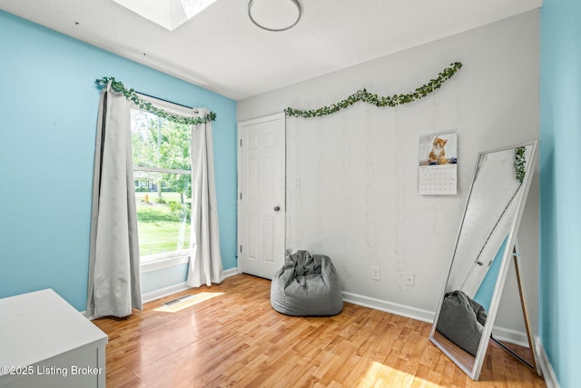 3003 Coffee Tree Ct, Crestwood, KY 40014 - misc room with a skylight, healthy amount of natural light, light wood-style flooring, and baseboards