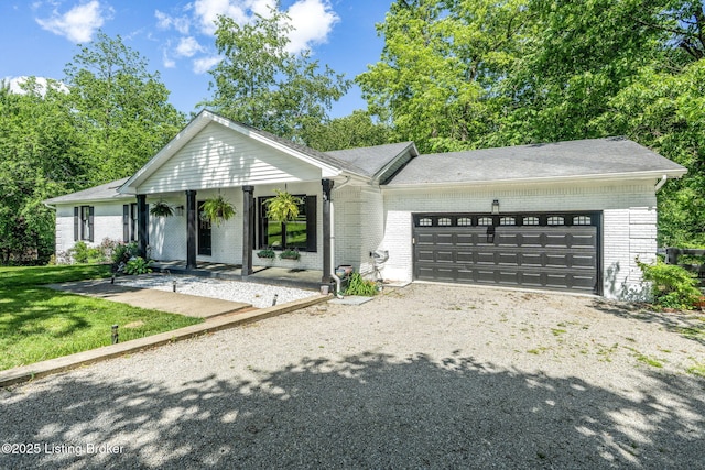3003 Coffee Tree Ct, Crestwood, KY 40014 - ranch-style home featuring brick siding, an attached garage, gravel driveway, covered porch, and a front lawn