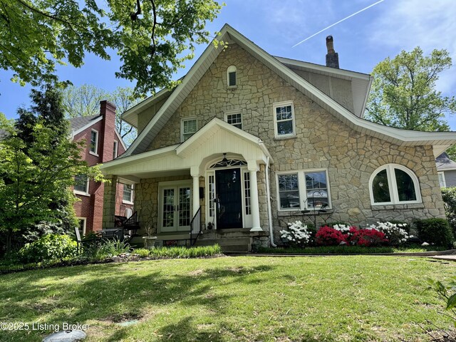 2302 Woodford Pl, Louisville, KY 40205 - view of front of property featuring a front lawn, french doors, and stone siding