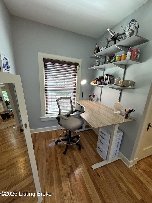 2302 Woodford Pl, Louisville, KY 40205 - home office with baseboards and wood finished floors