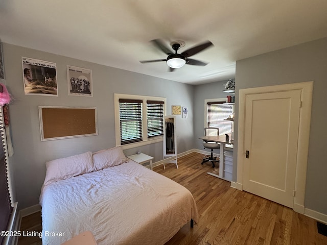 2302 Woodford Pl, Louisville, KY 40205 - bedroom featuring baseboards, ceiling fan, and light wood finished floors