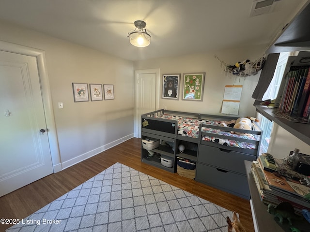 2302 Woodford Pl, Louisville, KY 40205 - bedroom featuring visible vents, baseboards, and dark wood-style floors