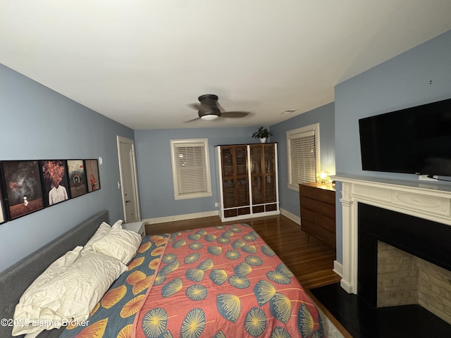 2302 Woodford Pl, Louisville, KY 40205 - bedroom featuring a ceiling fan, baseboards, wood finished floors, and a fireplace