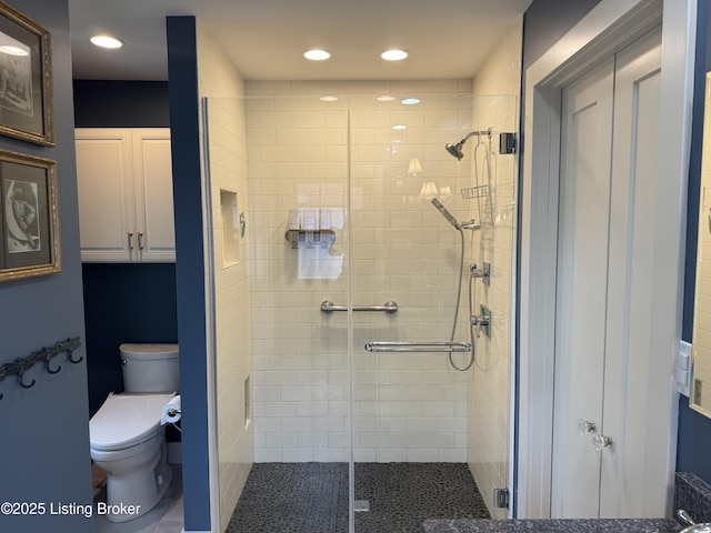 2302 Woodford Pl, Louisville, KY 40205 - bathroom featuring recessed lighting, a shower stall, and toilet