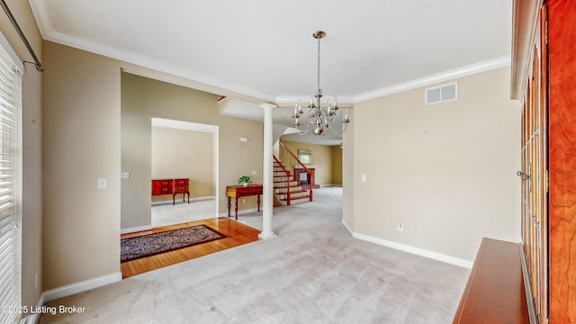 unfurnished dining area with ornamental molding, carpet, stairs, and visible vents