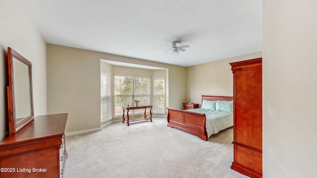 bedroom featuring a ceiling fan, baseboards, and carpet