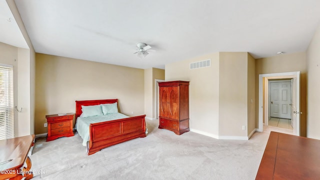 bedroom featuring baseboards, carpet flooring, and visible vents
