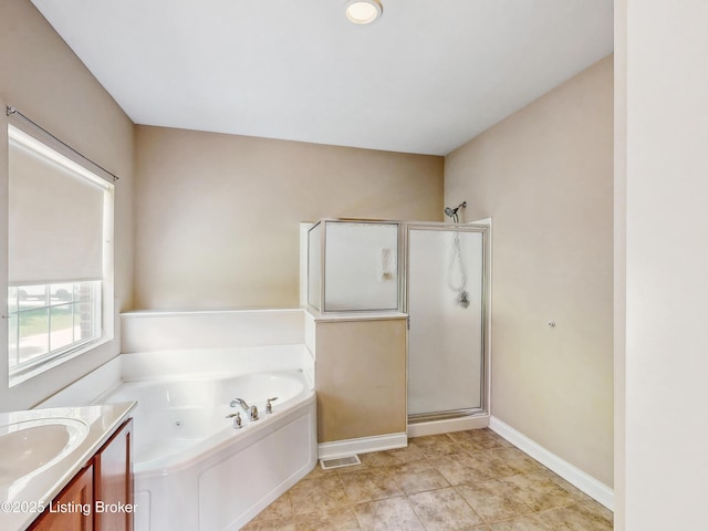 full bath featuring a jetted tub, vanity, baseboards, and a shower stall