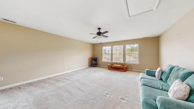 living area featuring visible vents, carpet flooring, baseboards, and ceiling fan
