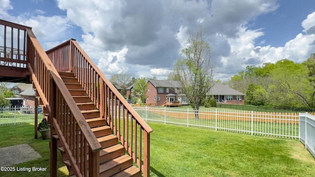 view of yard featuring stairs, a fenced backyard, and a deck