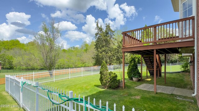 view of yard with a fenced backyard, stairs, and a deck