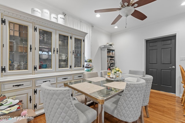 dining space with crown molding, recessed lighting, light wood finished floors, and ceiling fan