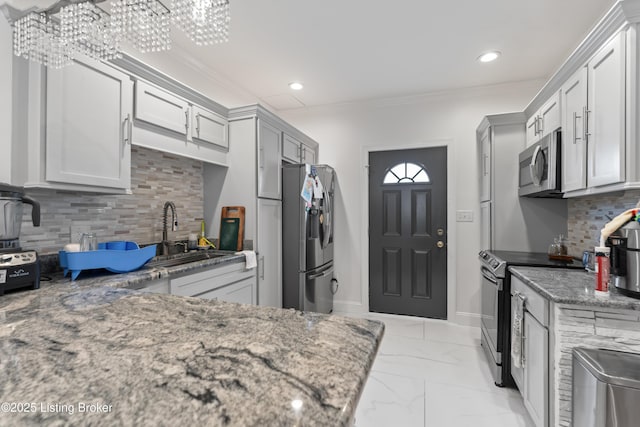 kitchen with appliances with stainless steel finishes, tasteful backsplash, a sink, light stone counters, and marble finish floor