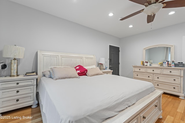 bedroom with light wood-style floors, ceiling fan, and recessed lighting