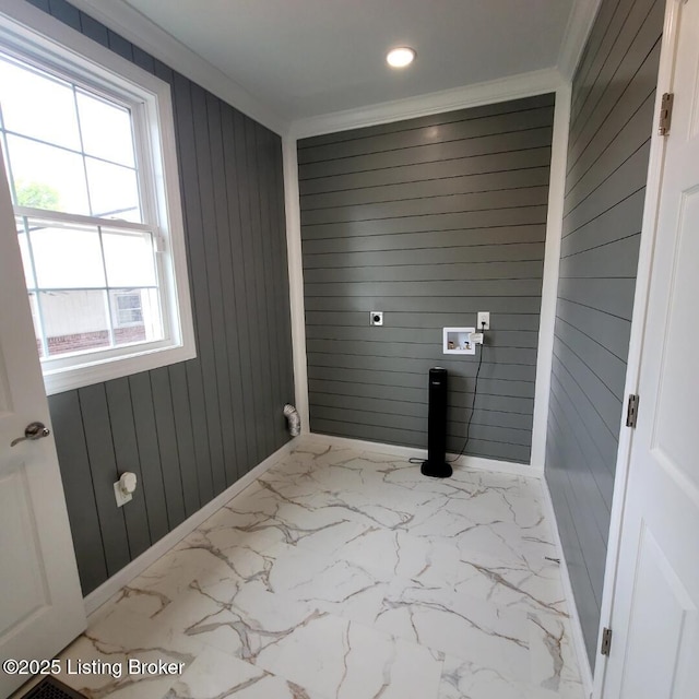 laundry area with wooden walls, ornamental molding, laundry area, and hookup for a washing machine