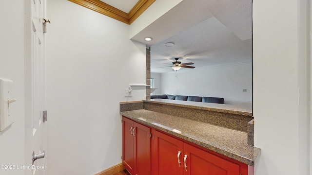 bathroom with vanity, ornamental molding, and ceiling fan