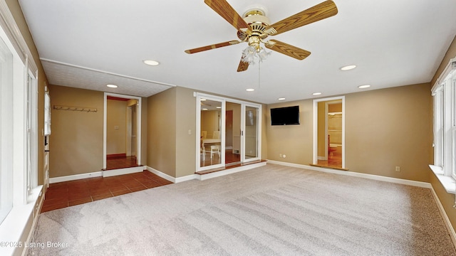 tiled spare room with carpet floors, ceiling fan, baseboards, and recessed lighting