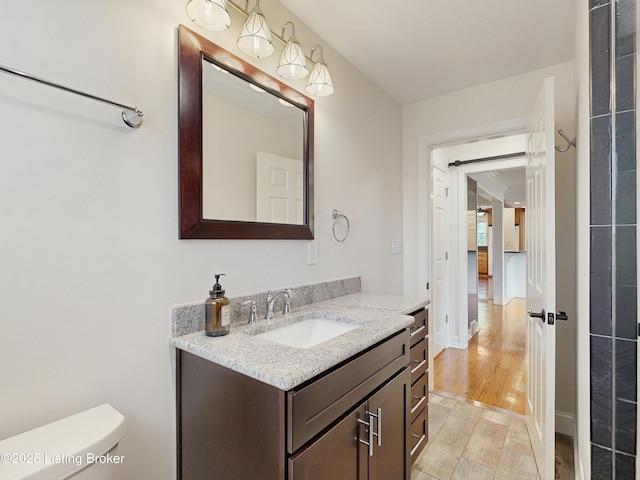 bathroom featuring vanity and toilet