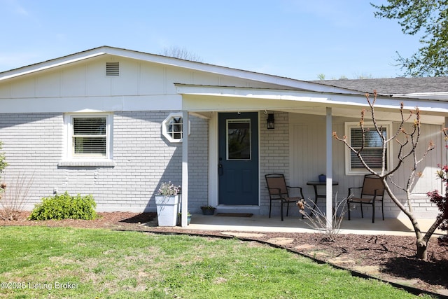 9500 Galene Dr, Louisville, KY 40299 - view of front of property featuring brick siding, a front yard, and a porch