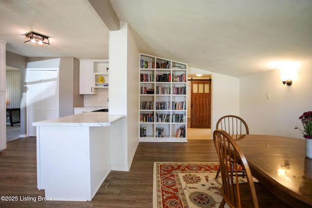 9500 Galene Dr, Louisville, KY 40299 - dining room featuring vaulted ceiling, dark wood-style floors, and built in shelves